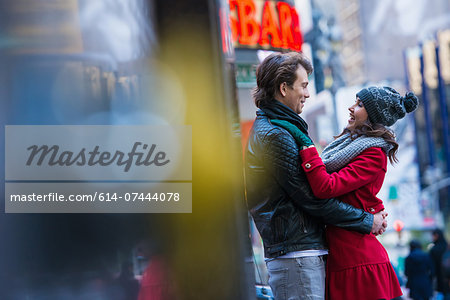 Young tourist couple hugging, New York City, USA