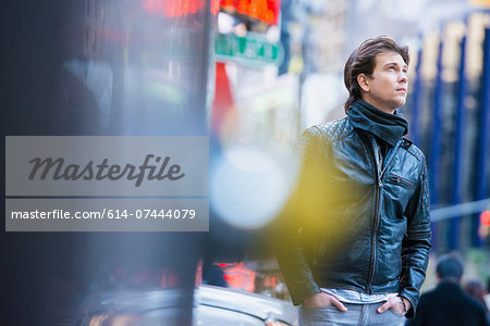 Young male tourist exploring streets, New York City, USA
