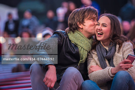 Young tourist couple on park bench, New York City, USA