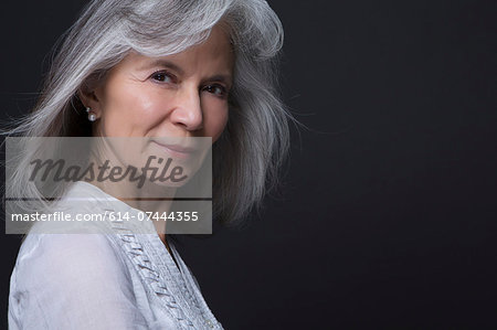 Studio portrait of beautiful senior woman