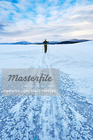 Mid adult woman skiing across vast landscape, Colter Bay, Wyoming, USA