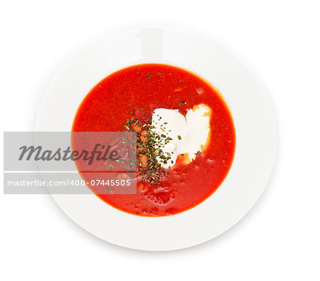 Ukrainian and russian national red borsch with sour cream and herbs closeup. Isolated on white background. Top view.