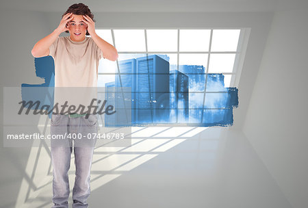 Embarressed brunette man against abstract screen in room showing server towers