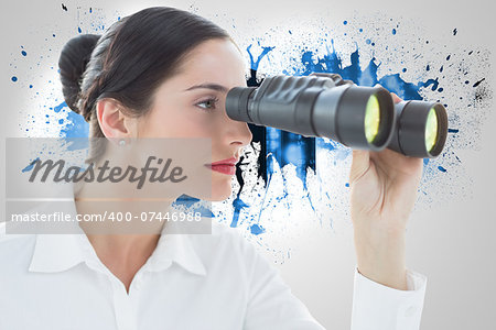 Business woman looking through binoculars against splash on wall revealing server tower