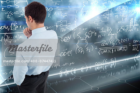 Thoughtful businessman with hand on chin against math equation background