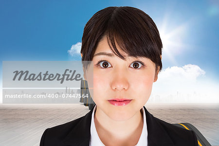 Serious businesswoman against bumpy road leading to city