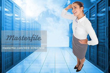 Smiling thoughtful businesswoman against server hallway in the blue sky