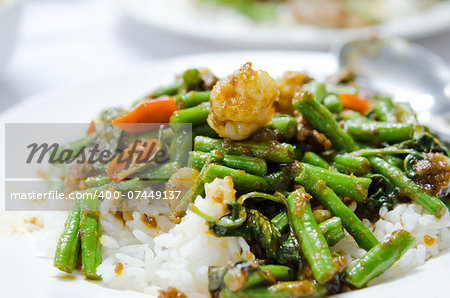 stir fry  chinese cowpea and shrimp with curry sauce over rice