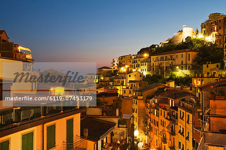 Riomaggiore rooftops and the Castle at dusk, Cinque Terre, UNESCO World Heritage Site, Liguria, Italy, Mediterranean, Europe