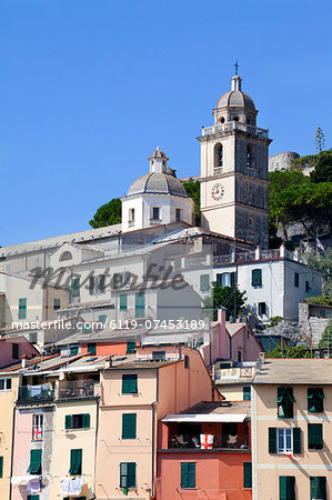 The Church of St. Lawrence sits above colourful buildings at Porto Venere, Cinque Terre, UNESCO World Heritage Site, Liguria, Italy, Europe