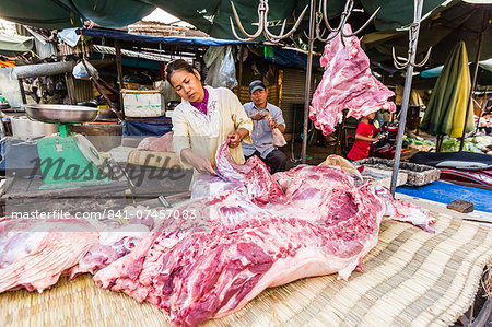 Fresh pork being prepared at street market in the capital city of Phnom Penh, Cambodia, Indochina, Southeast Asia, Asia