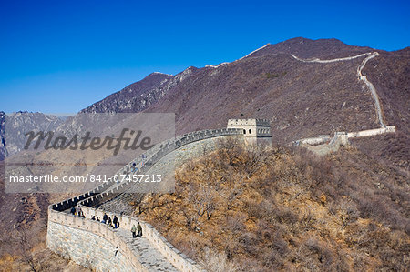 The ancient Great Wall of China snaking through mountains at Mutianyu, north of Beijing (formerly Peking)