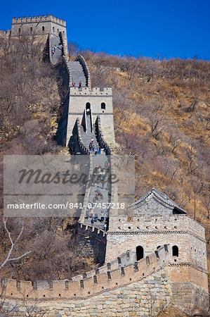 The ancient Great Wall of China snaking through mountains at Mutianyu, north of Beijing (formerly Peking)