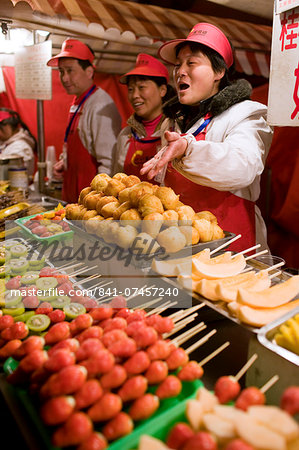 Stall selling candied fruit sticks in the Night Market, Wangfujing Street, Beijing, China