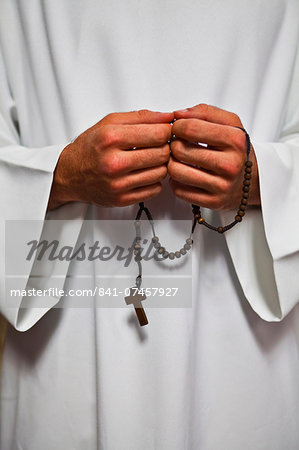 A priest holds his rosemary beads, Lyon, Rhone, France, Europe