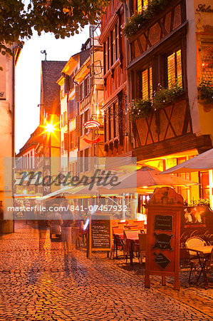 People wandering La Petite France at night, Grande Ile, UNESCO World Heritage Site, Strasbourg, Bas-Rhin, Alsace, France, Europe