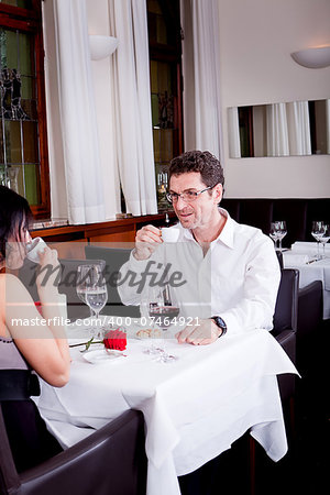 waiter serve fresh espresso for happy couple in restaurant