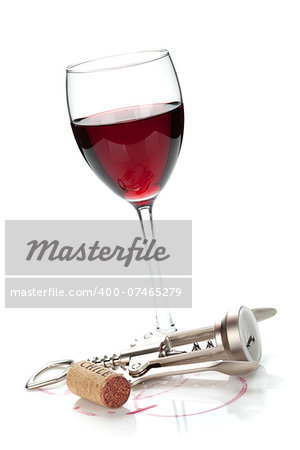 Red wine glass, cork and corkscrew. Isolated on white background