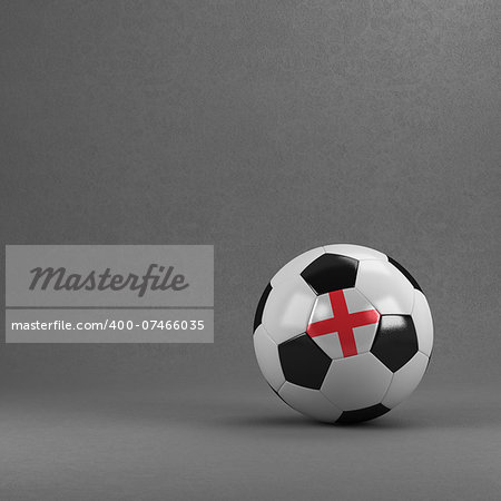 English soccer ball in front of plaster wall