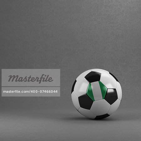 Nigerian soccer ball in front of plaster wall