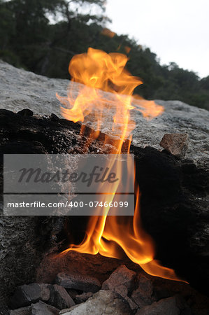 Yanartas (flaming rock) is generally believed to be the ancient Mount Chimaera ( Antalya, Turkey).  The fires are grouped over an area of 5000 m2 and are fueled by gas emissions which have been burning for at least 2500 years.