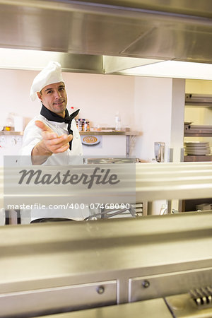 Portrait of a confident male chef standing in the kitchen