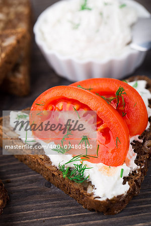 Sandwich with cream cheese and tomato on a bread