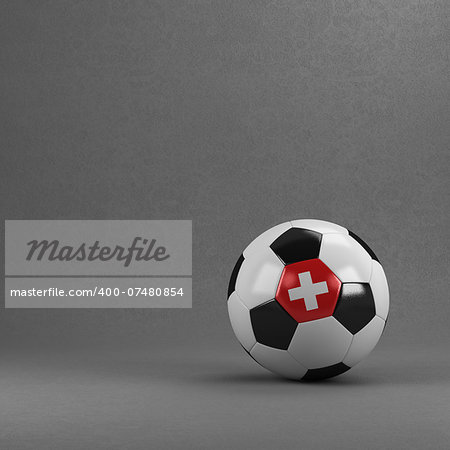 Swiss soccer ball in front of plaster wall