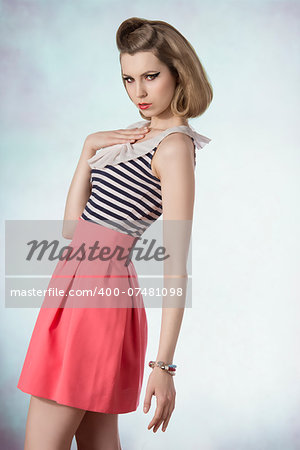 lovely blonde female posing in fashion shoot with vintage style, cute make-up and bracelets