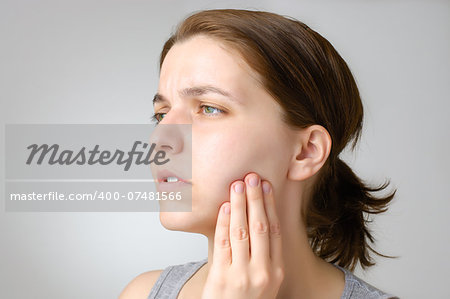 Young woman having toothache