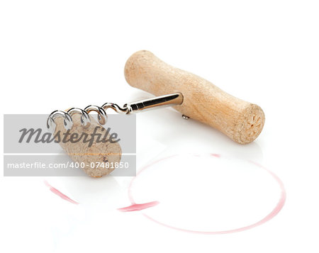 Cork and corkscrew with red wine stains. Isolated on white background