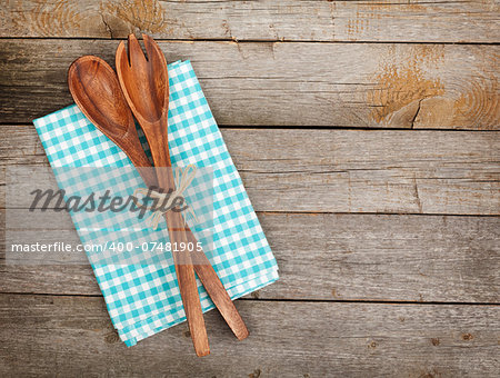 Vintage kitchen utensils over wooden table with copy space