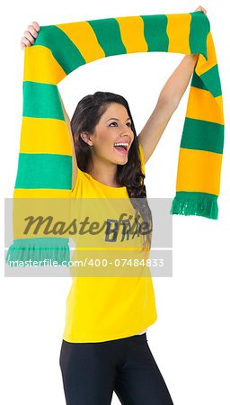 Excited football fan in brasil tshirt on white background