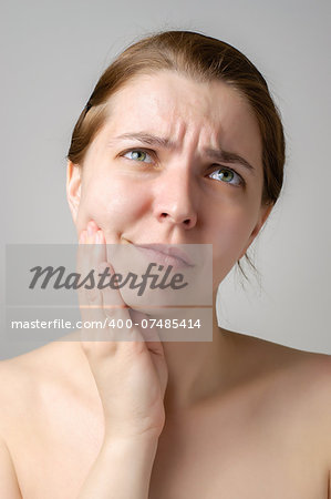 Young woman having toothache