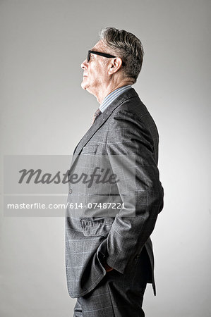 Portrait of senior man, wearing suit, side view Portrait of senior man, wearing suit, side view