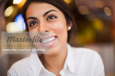 Portrait of young woman, smiling