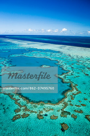 Australia, Queensland, Whitsundays, Great Barrier Reef Marine Park.  Aerial view of 'Heart Reef', a heart-shaped coral formation at Hardys Reef.