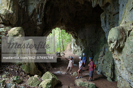 Central America, Belize, Cayo, a guide escorts tourists into the Actun Chapat cave near San Jose Succotz (MR)