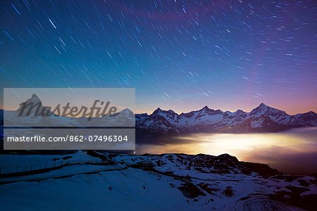 Europe, Valais, Swiss Alps, Switzerland, Zermatt, The Matterhorn (4478m) and town lights