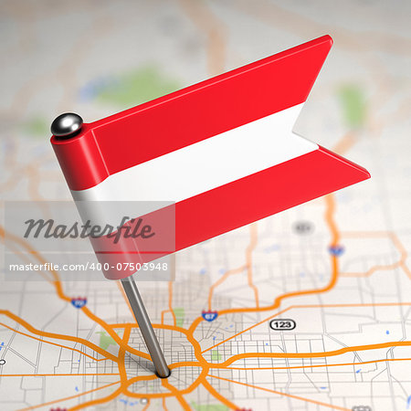 Small Flag of Austria Sticked in the Map Background with Selective Focus.