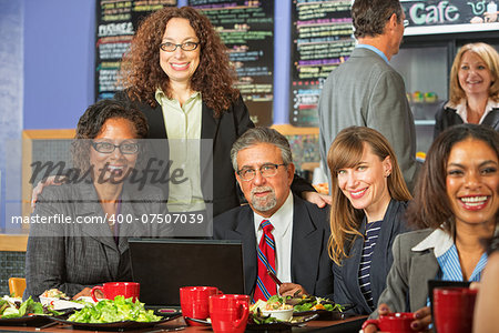 Happy diverse group of business people meeting for lunch
