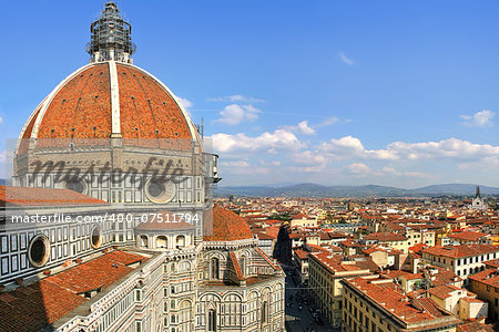 Dome of famous Duomo Cathedral and view of old historic part of Florence, Italy (view from above).