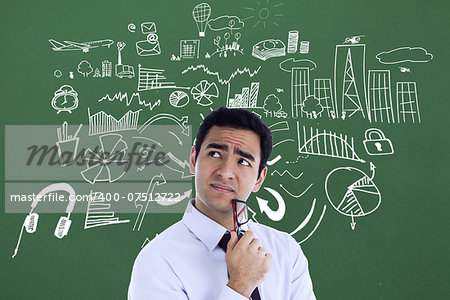 Composite image of thinking businessman holding glasses against green vignette