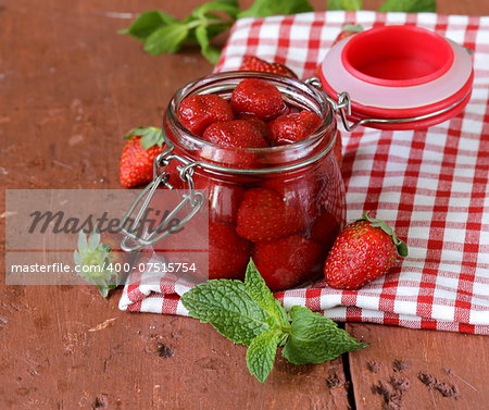 homemade jam from fresh ripe strawberries in a glass jar