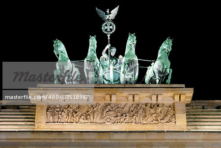 Brandenburg Gate detail at night, a former city gate and one of the main symbols of Berlin, Germany