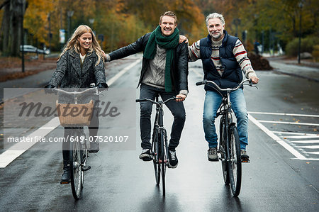 Friends cycling on street