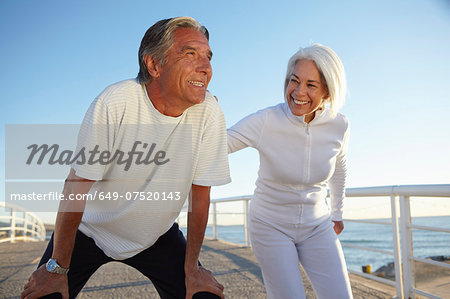 Couple doing squatting exercise