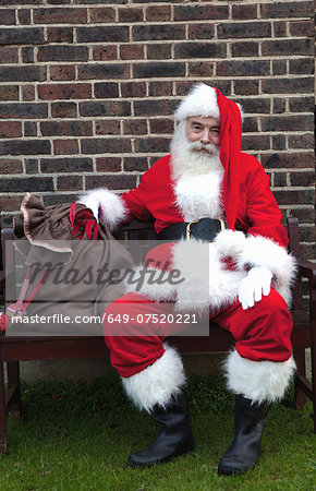 Santa Claus taking break on bench