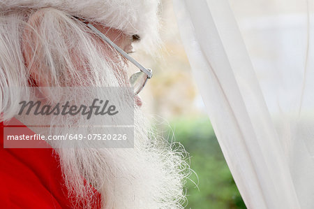 Santa Claus looking out of window