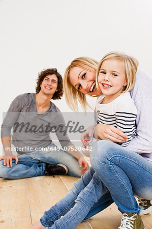 Studio shot of couple with daughter